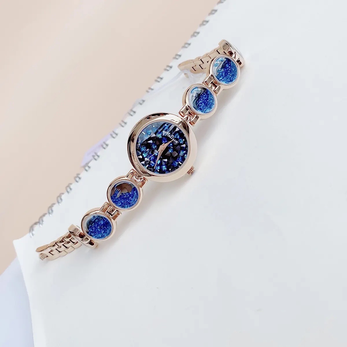 Đồng Hồ Melissa Mặt Tròn |Nữ Giới |Rose Gold |Lắc Tay Đính Đá Rơi Xanh Dương |Máy Pin (Quartz) |Size 28mm |donghogiatot.vn