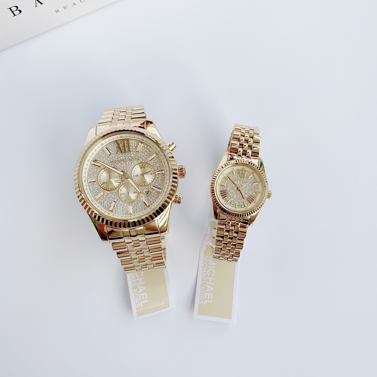 Đồng Hồ Michael Kors Lexington |Cặp Đôi |Mặt Full Đá |Dây Kim Loại Vàng Gold |Máy Pin (Quartz) |Size 44x22mm |donghogiatot.vn