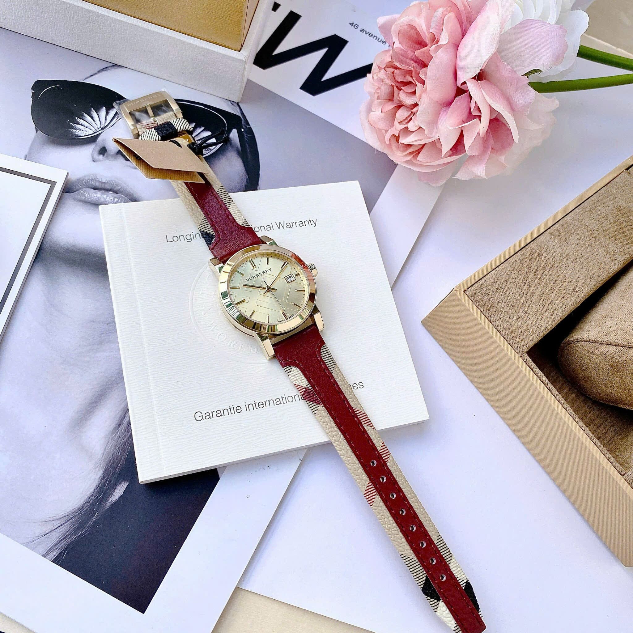 Đồng Hồ Burberry The City Haymarket |Nữ Giới |Vàng Gold |Dây Da Đỏ |Máy Pin (Quartz) |Size 34mm |donghogiatot.vn