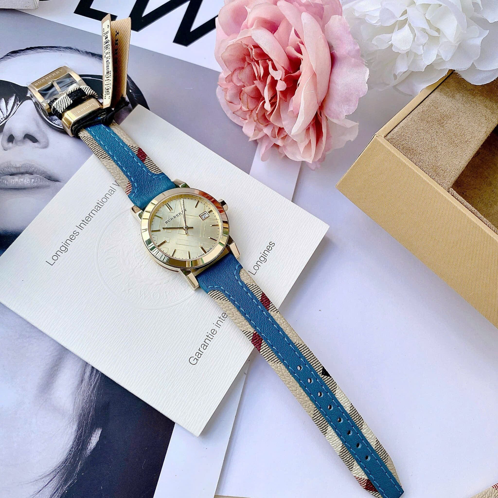 Đồng Hồ Burberry The City Haymarket |Nữ Giới |Vàng Gold |Dây Da Xanh Dương |Máy Pin (Quartz) |Size 34mm |donghogiatot.vn