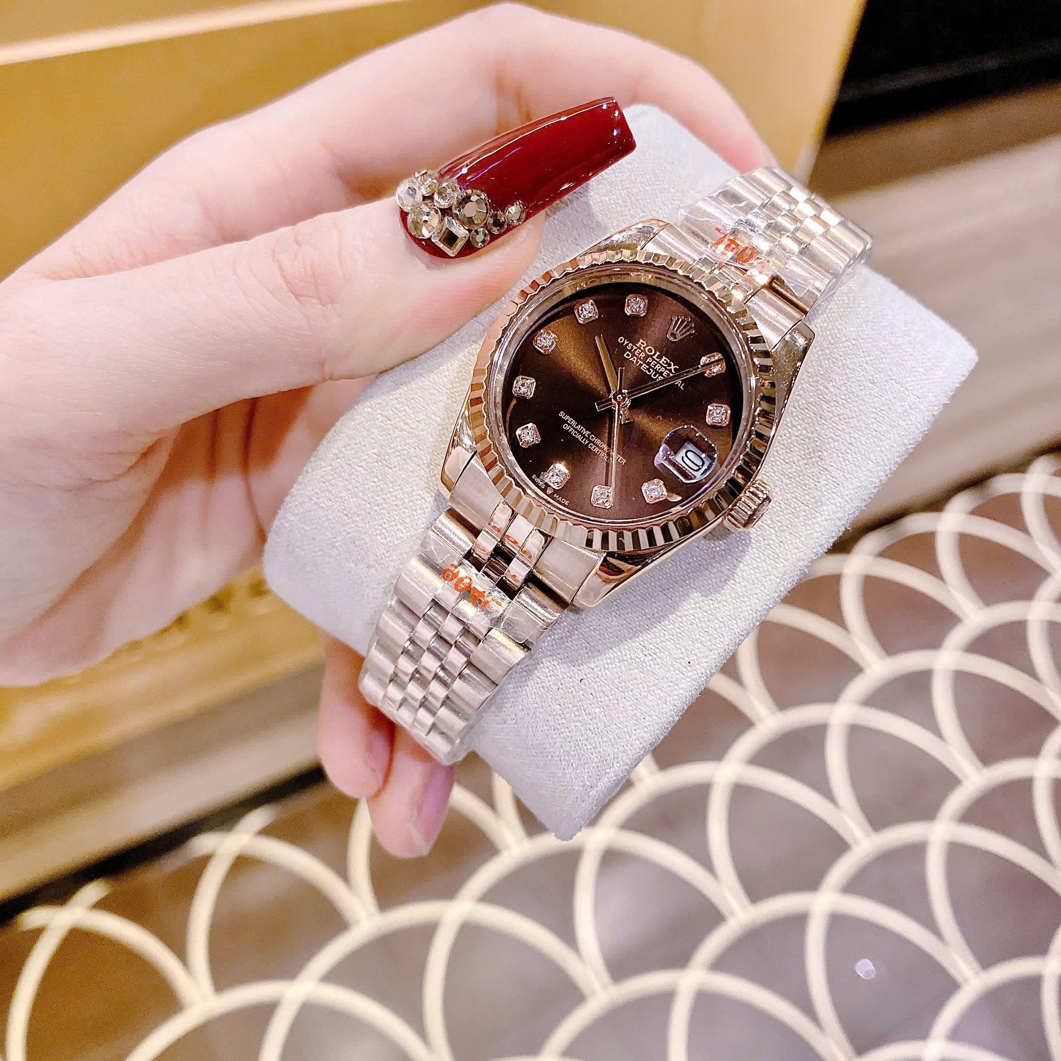 Đồng Hồ Rolex Date Just |Nữ Giới |Mặt Nâu |Niềng Khía |Dây Kim Loại Rose Gold |Máy Pin (Máy Quartz) |Size 31mm |donghogiatot.vn