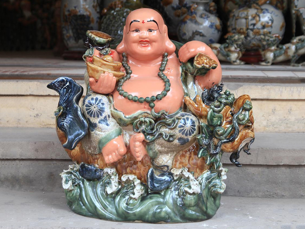 Tượng Sứ Di Lặc Men Rạn Cưỡi Cá Chép Hóa Rồng - Gốm Sứ Bát Tràng