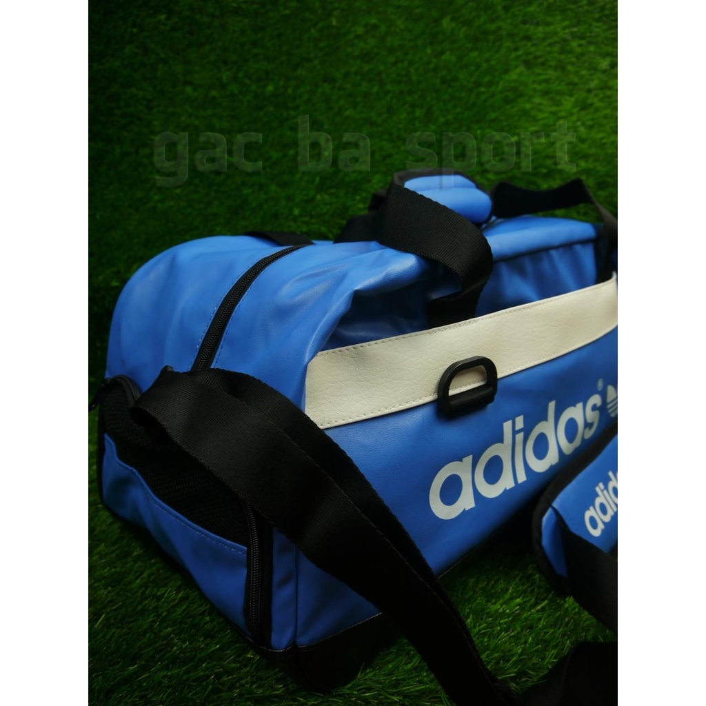 Túi đựng Adidas xanh trắng da bóng to