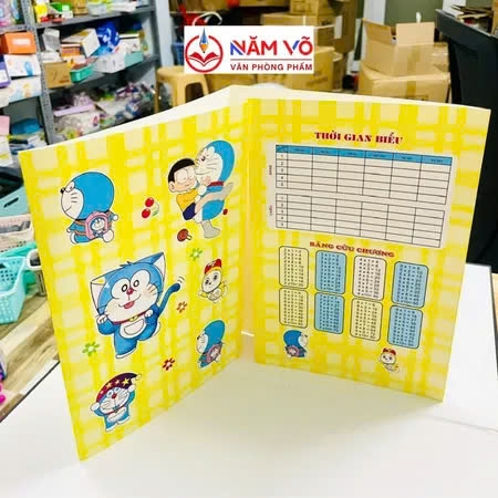 Bìa Kê Tập Doremon (Xanh Dương, Lá, Đỏ, Vàng, Tím, Hồng, Cam) (10 Tờ/Xấp) (10 Xấp/Bó)