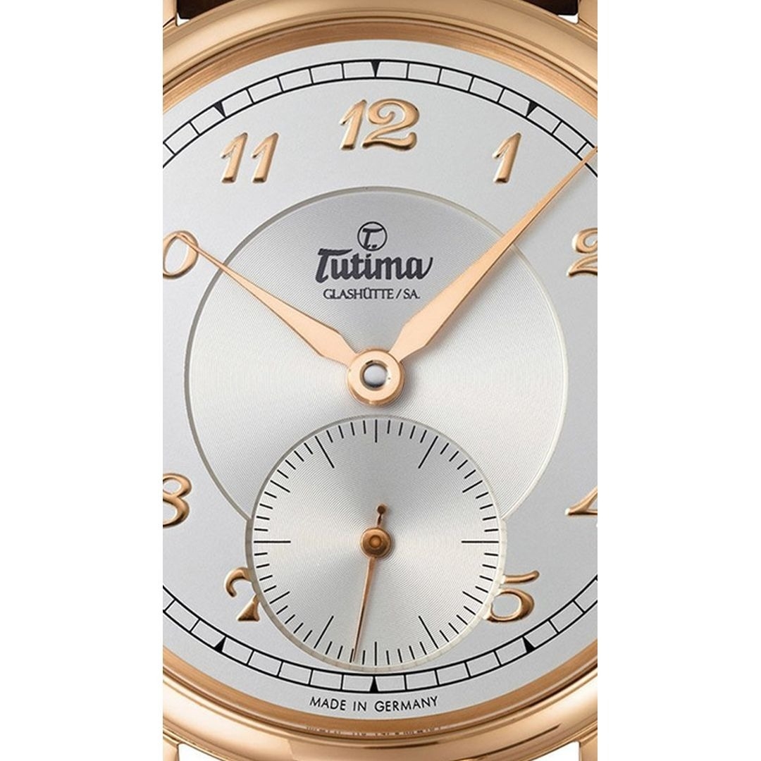 Đồng hồ đeo tay thương hiệu Tutima, dòng sản phẩm Hommage, Ref no: 6800-02, mặt số bạc, size 43mm, máy lên cót tay, vỏ và khóa đồng hồ bằng vàng hồng 18k, dây đeo da cá sấu, hàng mới 100%