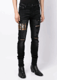 AMIRI appliqué-logo distressed-effect slim-fit jeans