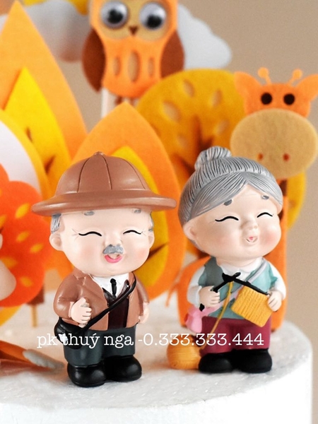 TUONG-Đôi ông bà đeo túi - sứ L11