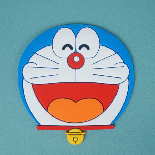 Mặt Doremon cười nhựa dẻo (kt TO 8x7cm).