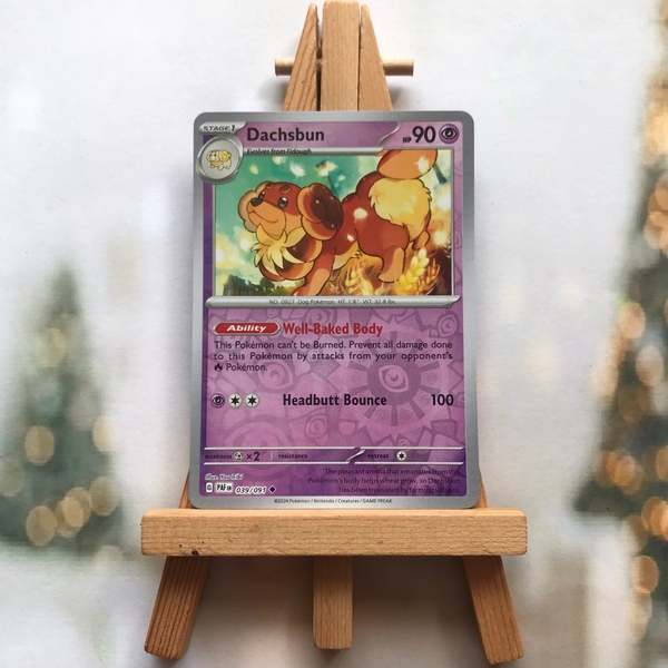 Thẻ hình Pokemon Dachsbun 039/091 - Lá bài lẻ Paldean Fates Uncommon Reverse Holo tiếng Anh chính hãng