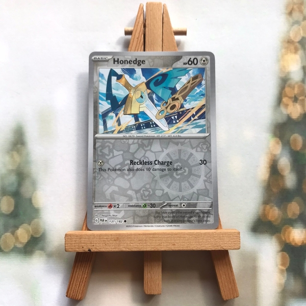 Thẻ hình Pokemon Honedge 131/182 - Lá bài lẻ Scarlet & Violet: Paradox Rift Common Reverse Holo tiếng Anh chính hãng