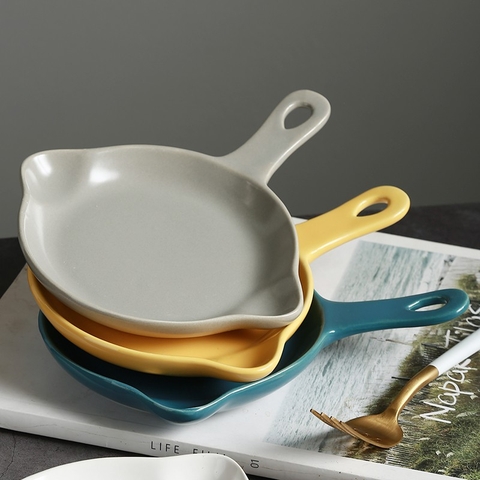 Dĩa gốm sứ hình chảo có tay cầm