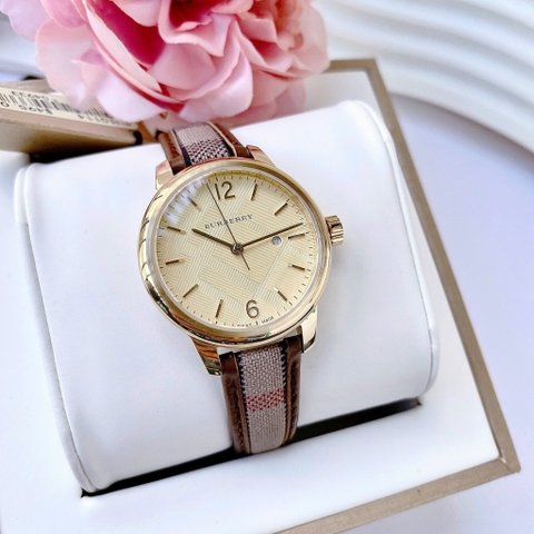Burberry The Classic Round |Nữ Giới |Vàng Gold |Dây Vải Bọc Da Nâu |Máy Pin (Quartz) |Size 32mm