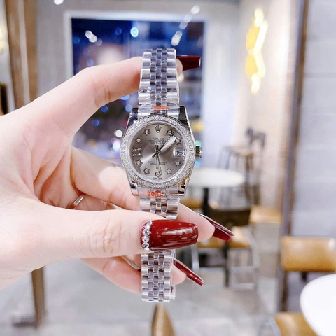Rolex Date Just |Nữ Giới |Mặt Xám |Niềng Đá |Dây Kim Loại Silver |Máy Pin (Máy Quartz) |Size 31mm