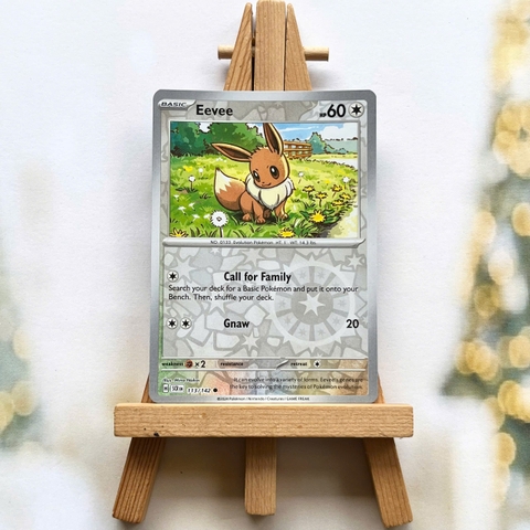 Thẻ hình Pokemon Eevee 113/142 - Lá bài lẻ Stellar Crown Common Reverse Holo tiếng Anh chính hãng