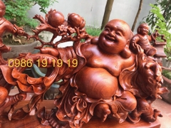 Tượng di lặc kéo bao tài lộc gỗ hương, cao 40cm rộng 86cm sâu 23cm