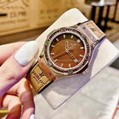 Hublot Geneve |Nữ Giới |Rose Gold |Đính Đá |Dây Da Nâu Bọc Silicone |Máy Pin (Máy Quartz) |Size 34mm