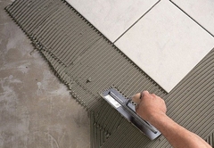 Có nên sử dụng keo dán gạch thay thế hồ dầu để lát sàn nhà?