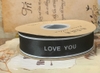 Ruybang vải kt 2.5cmx 35m - chữ love you in màu đen-nền TRẮNG.