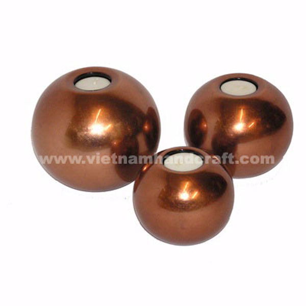 Set of 3 handcrafted lacquered wooden tealight candle holders in bronze silver Set of 3 handcrafted lacquered wooden tealight candle holders in bronze silver