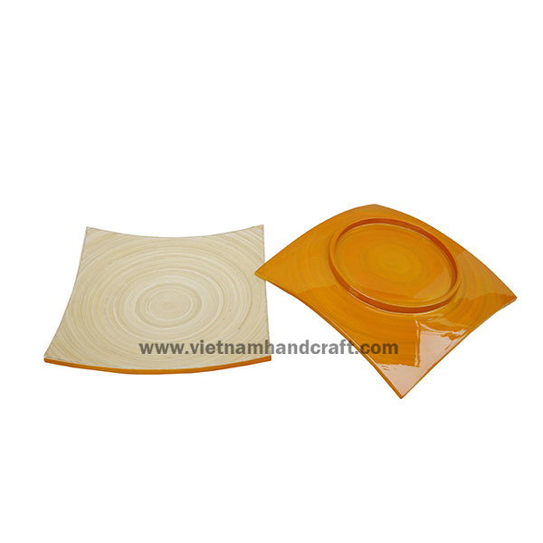 Handmade bamboo food plate. Inside in natural, outside in yellow Handmade bamboo food plate. Inside in natural, outside in yellow