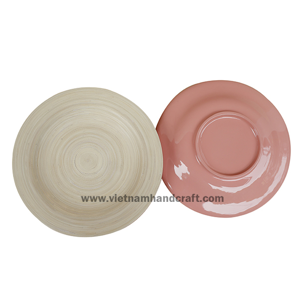 Handmade bamboo food serving plate. Inside in natural, outside in pink Handmade bamboo food serving plate. Inside in natural, outside in pink