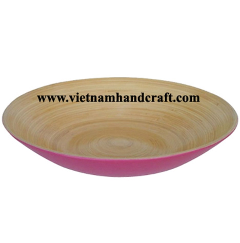Handmade coiled bamboo salad serving dish. Inside in natural, outside hand lacquered in pink Handmade coiled bamboo salad serving dish. Inside in natural, outside hand lacquered in pink