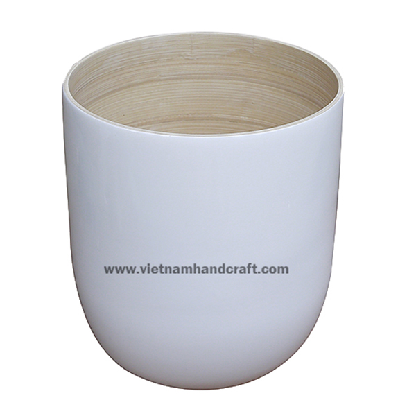 Handmade spun bamboo planter. Inside in natural, outside hand finished in white Handmade spun bamboo planter. Inside in natural, outside hand finished in white