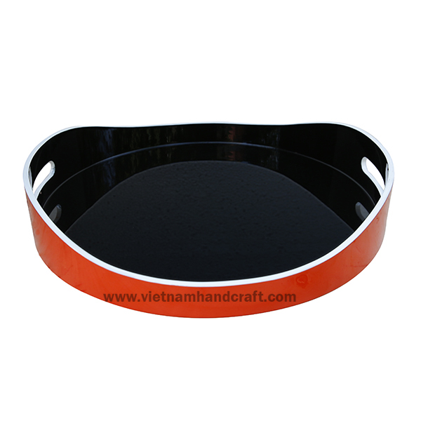 Handmade wooden lacquerware serving tray. Inside in black, outside in orange with rims in white Handmade wooden lacquerware serving tray. Inside in black, outside in orange with rims in white