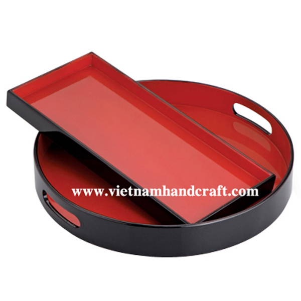 Lacquer wood serving trays. Insides in solid red, outsides in black Lacquer wood serving trays. Insides in solid red, outsides in black