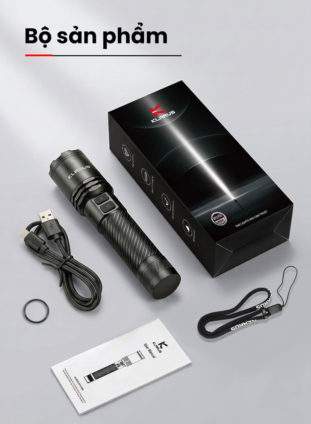 Bộ sản phẩm gồm đèn pin KLARUS A1 PRO V1, pin 18650, cáp sạc USB-C, dây đeo, gioăng dự phòng và hướng dẫn sử dụng.