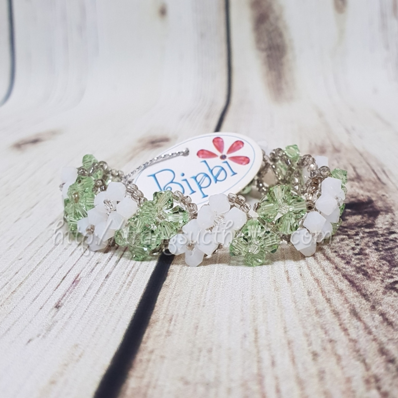 Vòng tay pha lê Swarovski xanh lá - trắng đục
