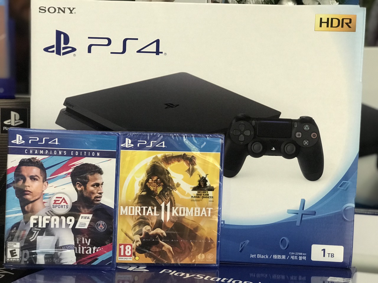 Máy PS4 Slim 1TB + FiFa 19 Champions + Mortal Kombat 11