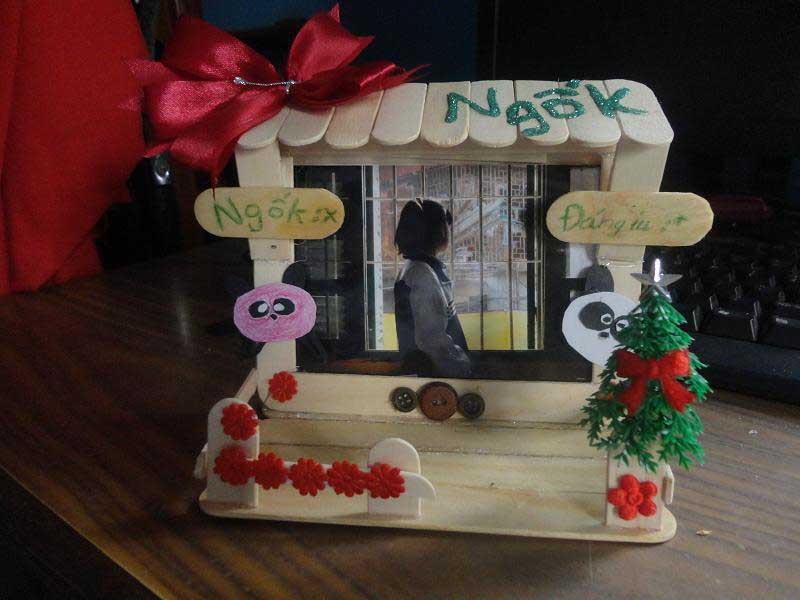 Handmade photo frame made of popsicle sticks