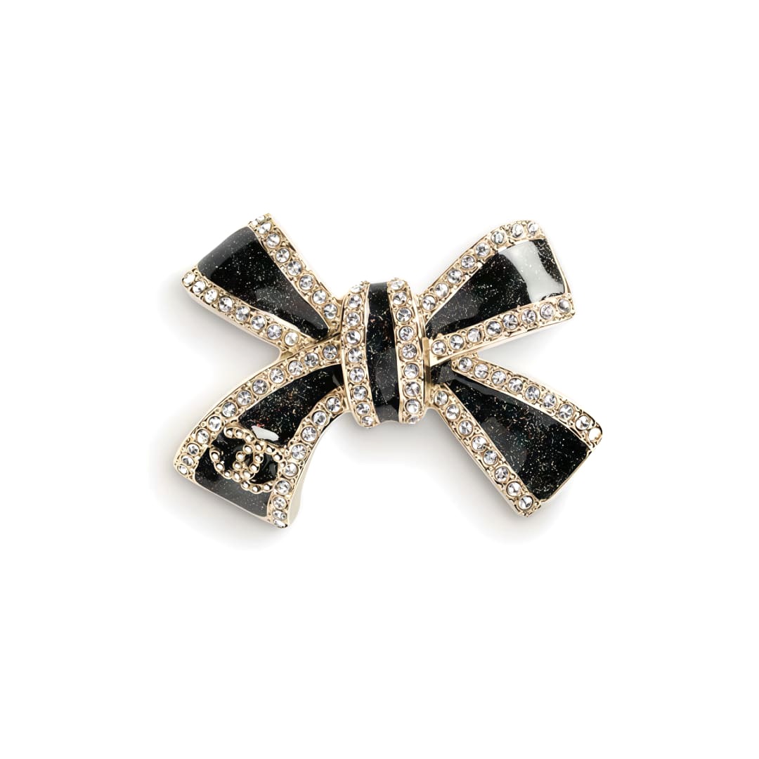 TRÂM CÀI CHANEL 25B NƠ VÀNG ĐEN ORNAMENT