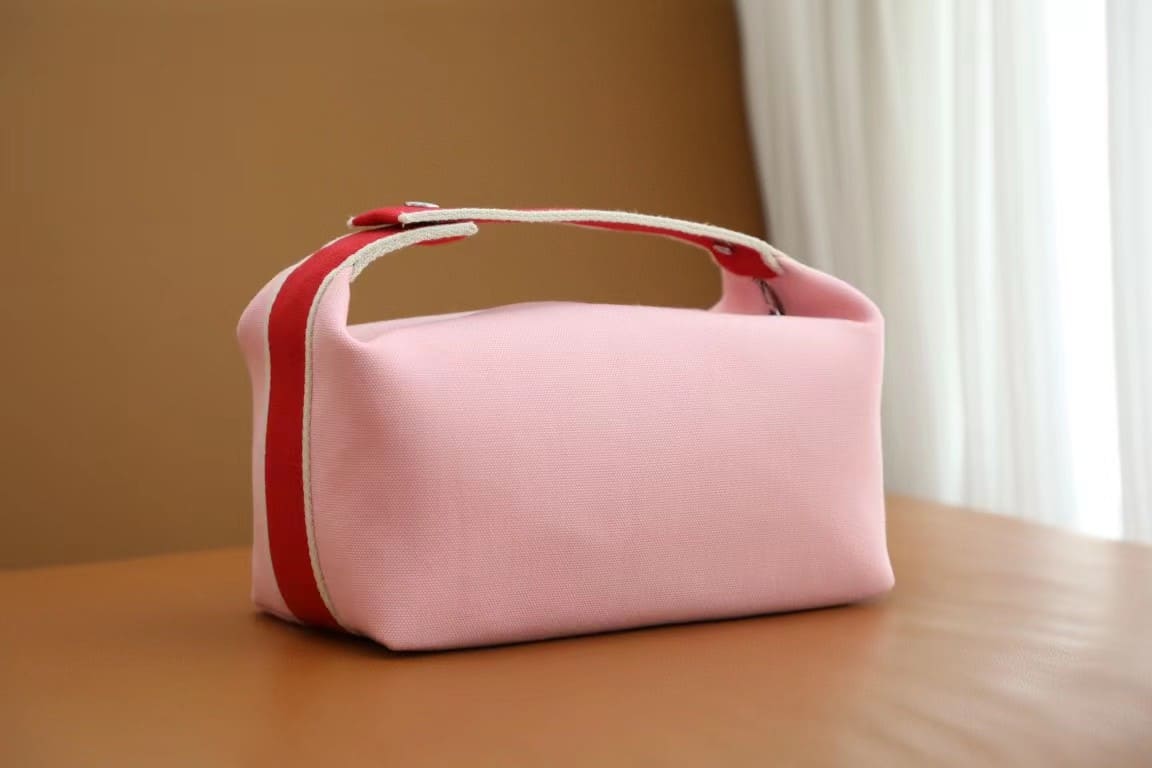TÚI HERMES TROUSSE DE TOILETTE BRIDE A BRAC PM H MÀU HỒNG