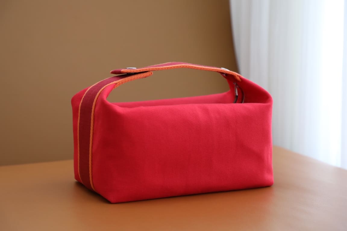 TÚI HERMES TROUSSE DE TOILETTE BRIDE A BRAC PM H MÀU ĐỎ