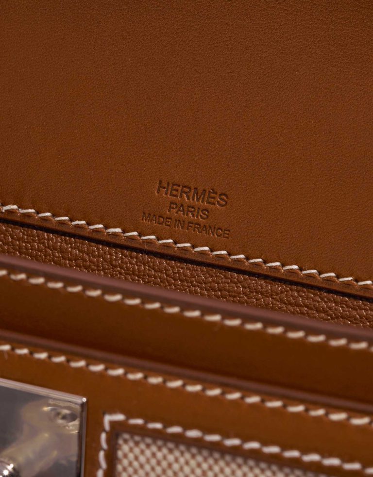 TÚI Hermès Kelly Dépêches Pouch 25 Toile Barenia Fauve Silver Buckle khóa trắng