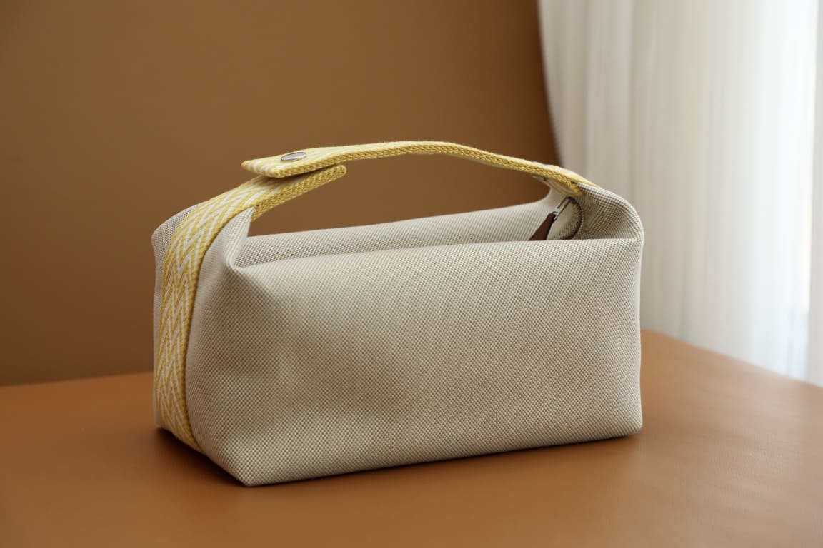 TÚI HERMES TROUSSE DE TOILETTE BRIDE A BRAC PM H MÀU VÀNG