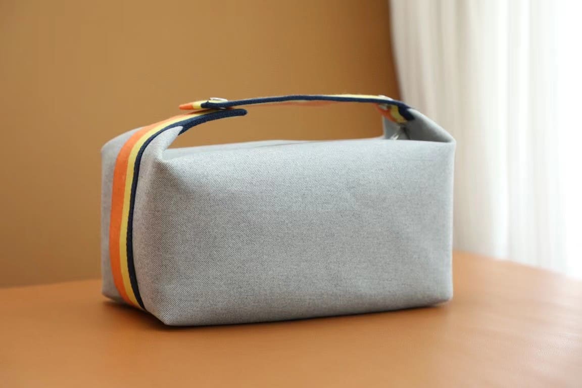 TÚI HERMES TROUSSE DE TOILETTE BRIDE A BRAC PM H MÀU CAM