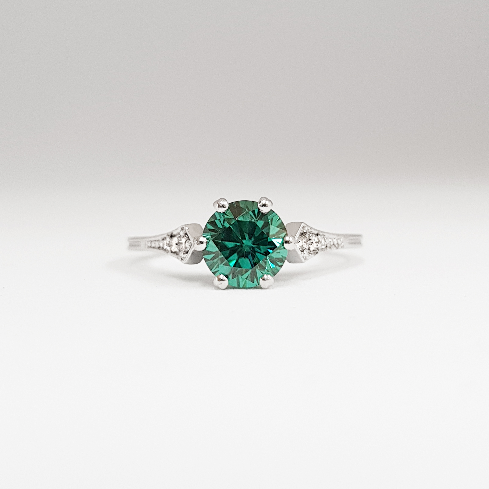 TEAL MOISSANITE AND DIAMOND ENGAGEMENT RING