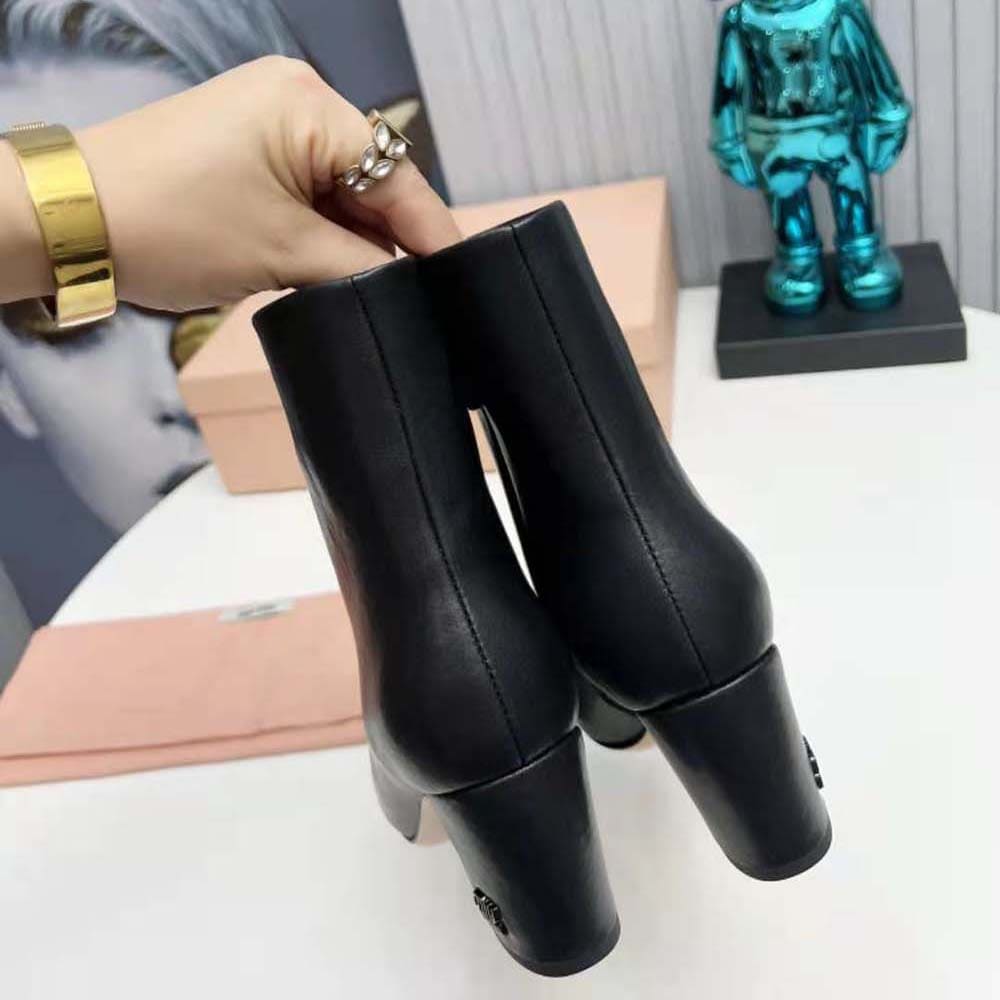 GIÀY Miu Miu Women Leather Booties with Metal Lettering Logo-Black