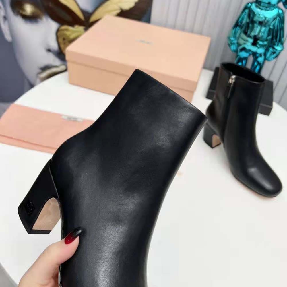 GIÀY Miu Miu Women Leather Booties with Metal Lettering Logo-Black