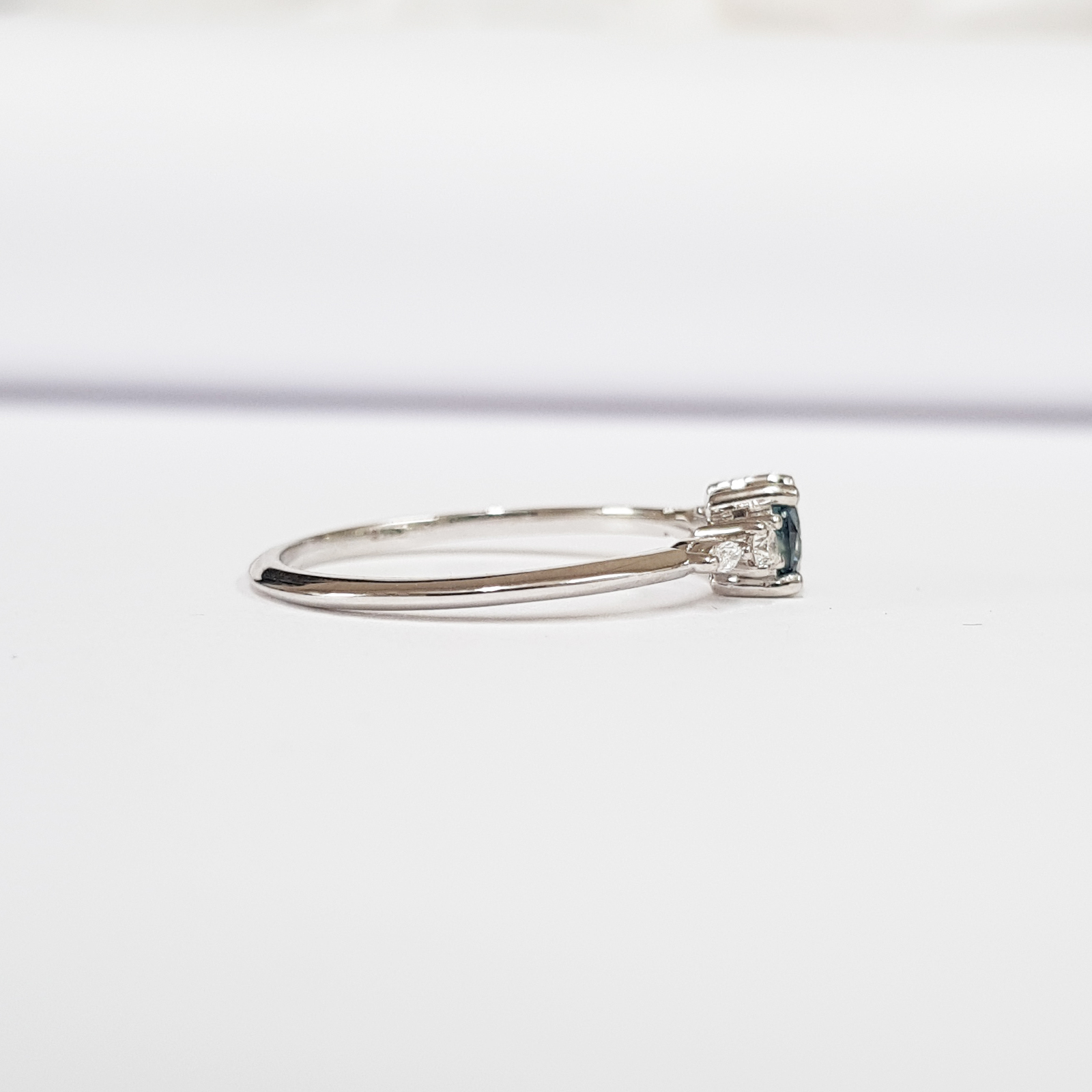 TEAL SAPPHIRE AND DIAMOND ENGAGEMENT RING