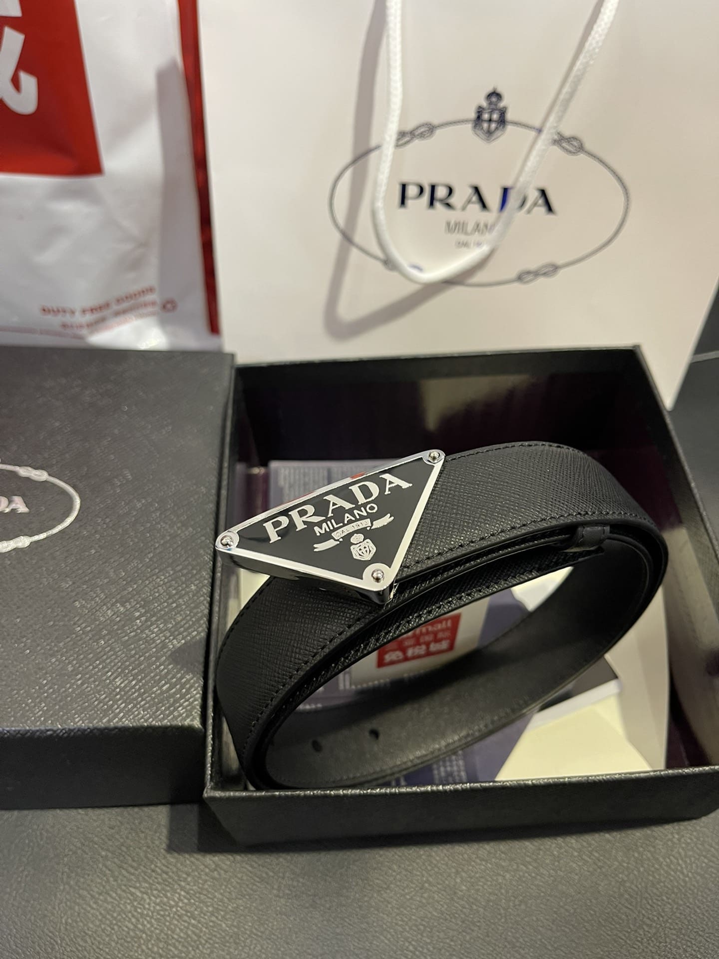DÂY LƯNG PRADA TRIANGLE ENAMEL SAFFIANO LEATHER