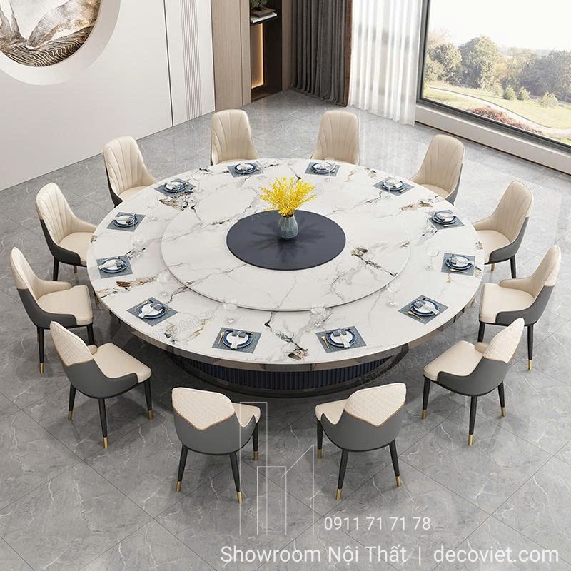 Bàn ăn tròn mặt đá lớn, đường kính 2m – 2m2 cho 10–12 người.