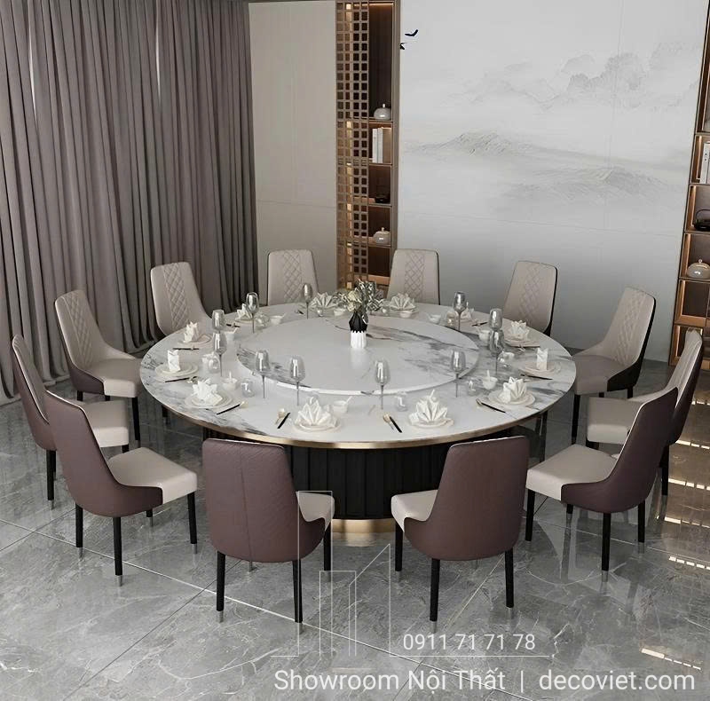 Bàn ăn tròn mặt đá lớn 12–14 ghế, phù hợp không gian nhà hàng cao cấp.