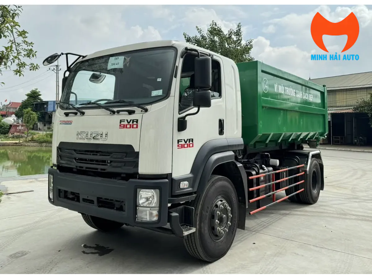 Xe Isuzu cabin trắng và thùng rác rời xanh nhìn chéo phía trước
