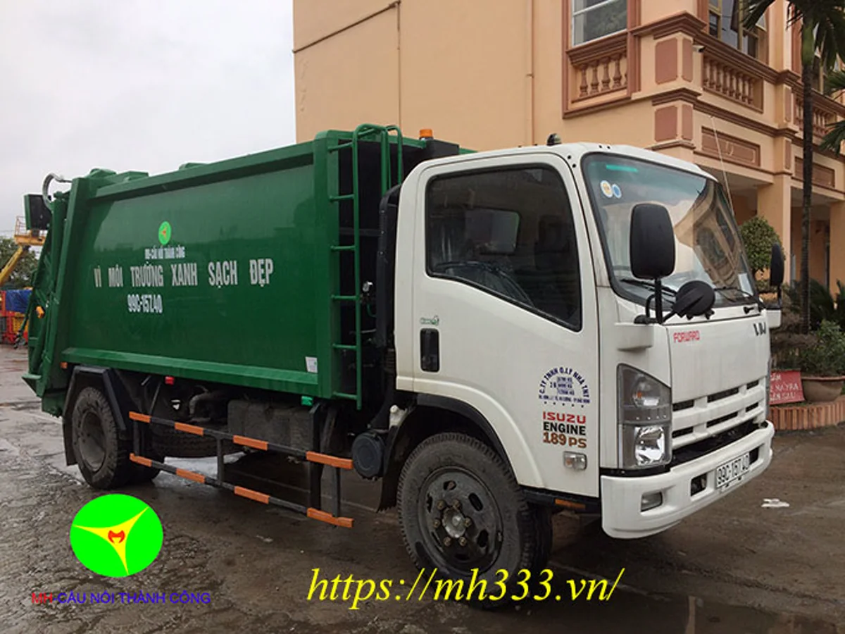 Xe ép rác Vĩnh Phát FN129S4 cabin trắng, thùng xanh nhìn từ góc trước