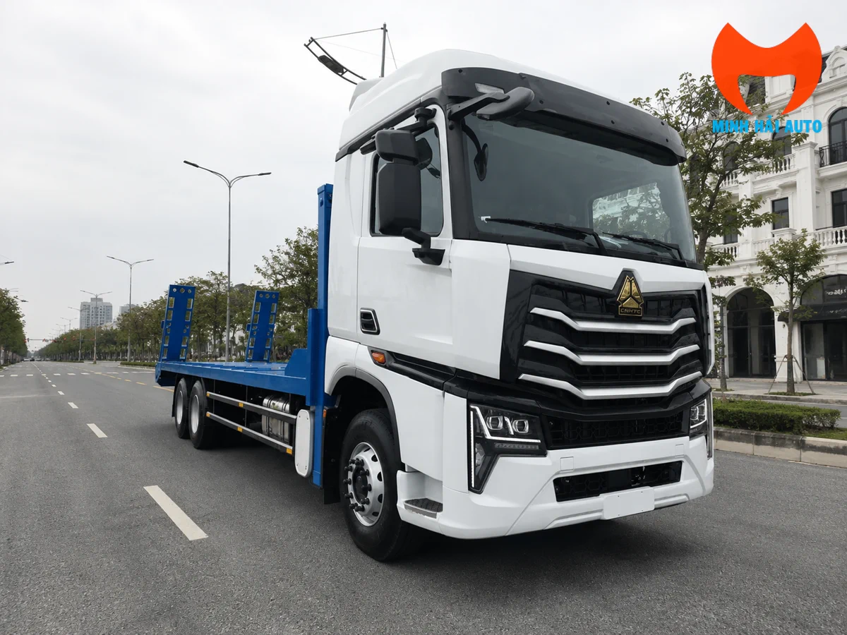 Xe nâng đầu Howo sàn phẳng chở máy công trình