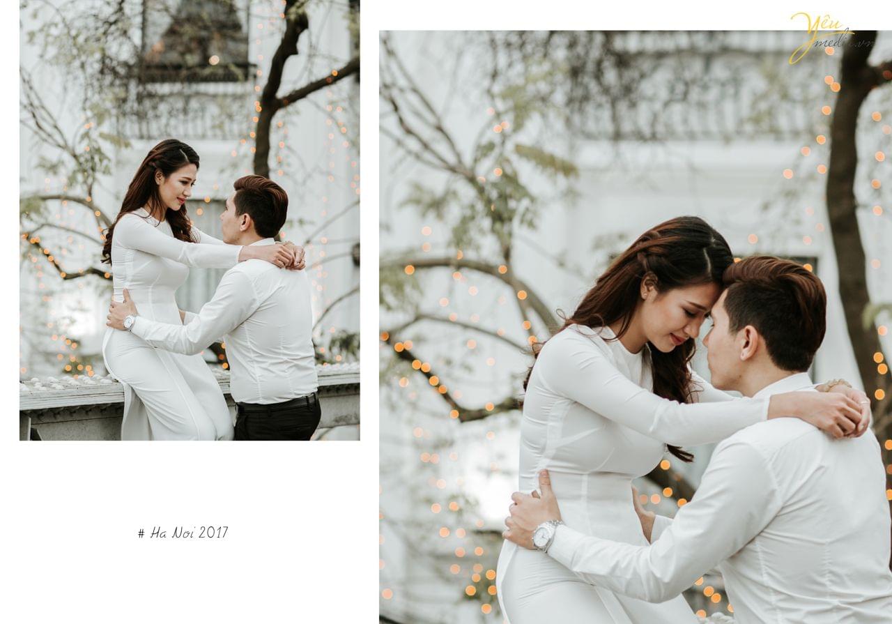 ảnh cưới áo dài cô dâu ngồi trên thành cầu chú rể ôm eo